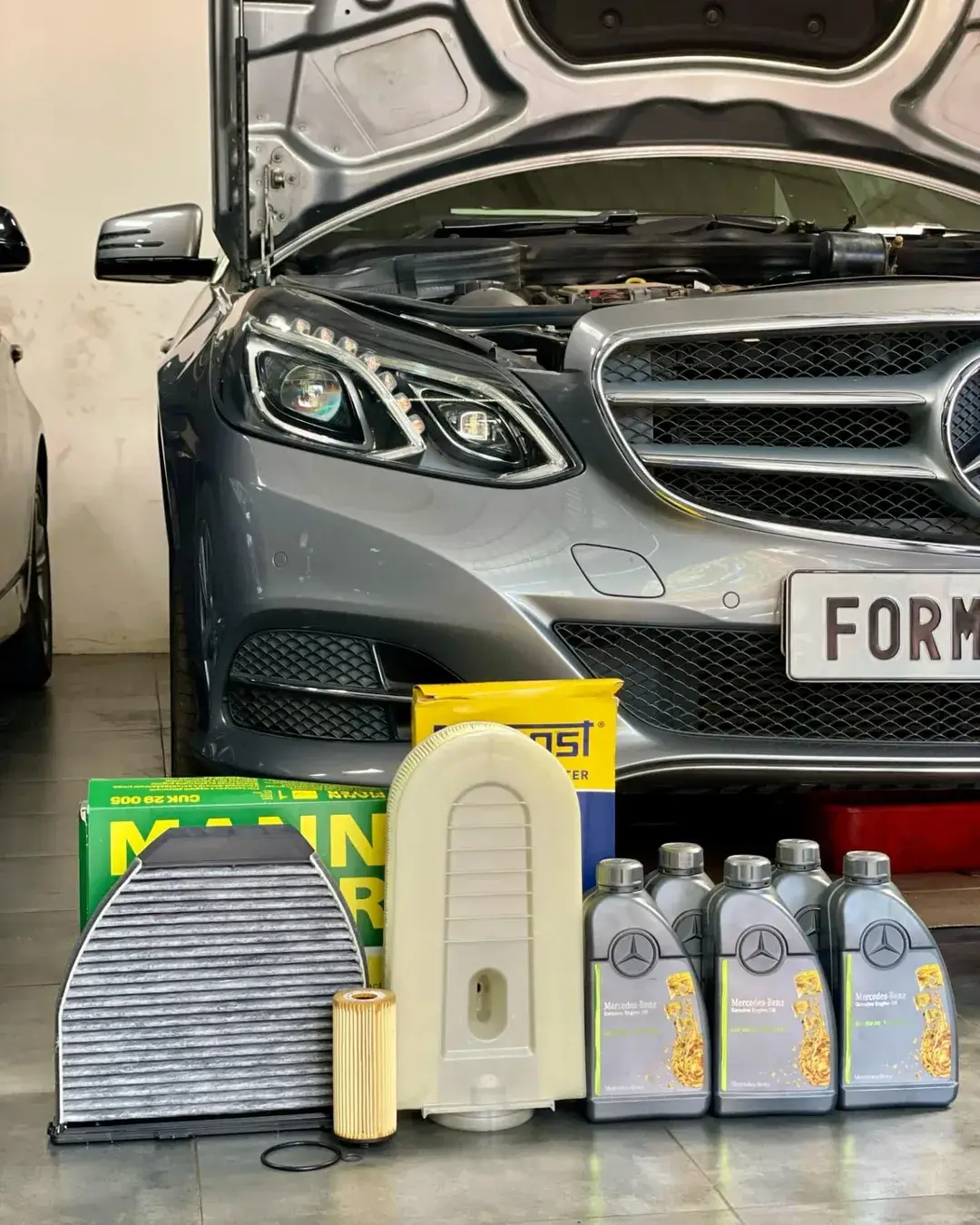 Mercedes Benz E250 experiencing several oil and coolant leaks! Also requires periodic service.R