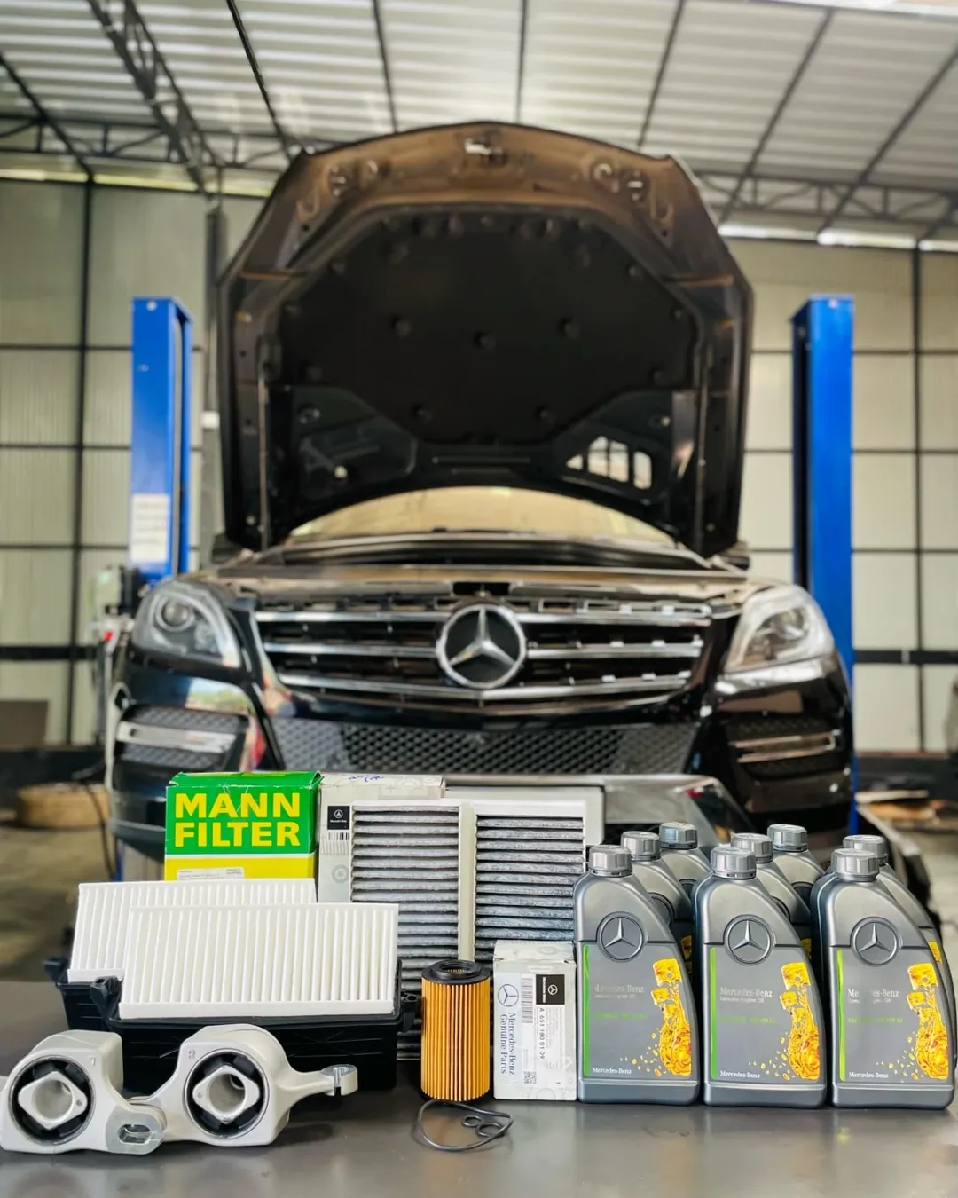 Mercedes Benz ML350 in for periodic serviceReplacing-. Engine oil. Oil filter. Air filter. Cabi